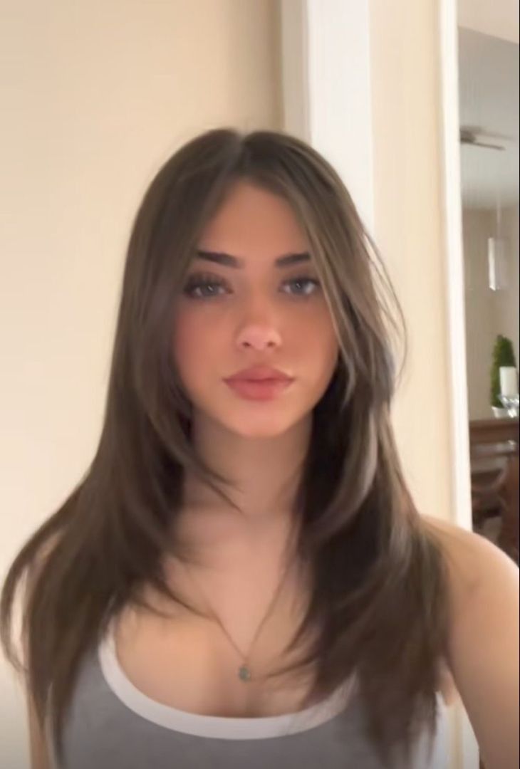Discover the Best Haircuts for Every Face Shape (Say Goodbye to Bad Hair Days!) - 9. Heart Face: Long Layers with Bangs 1
