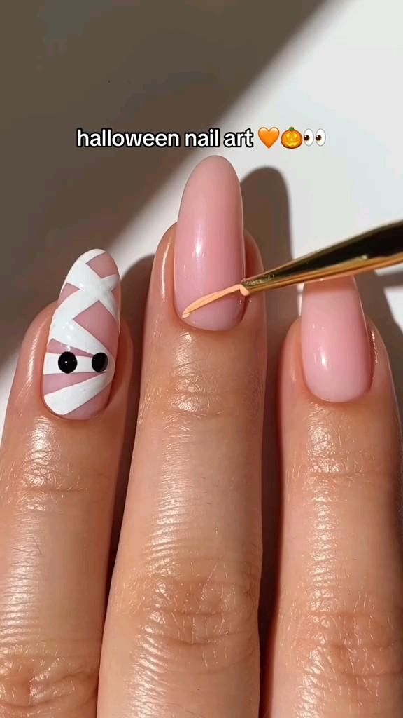 10 Simple Halloween Nail Art Ideas: Cute Ghost Nails, Spooky Designs & More - 1. Friendly Ghost Nails on a Milky Base 1